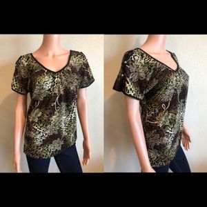 Busy “cool shoulder” blouse